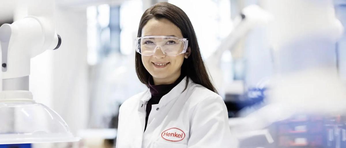 A person in protective lab wear in a laboratory setting