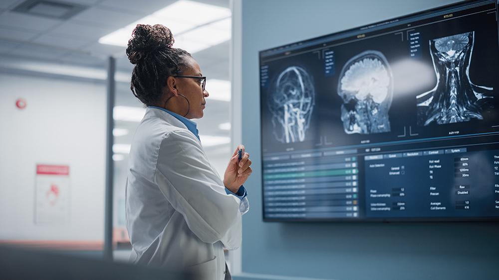 Doctor looking at x-rays on screens