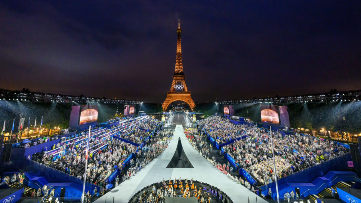 a large crowd in front of the Eiffel Tower