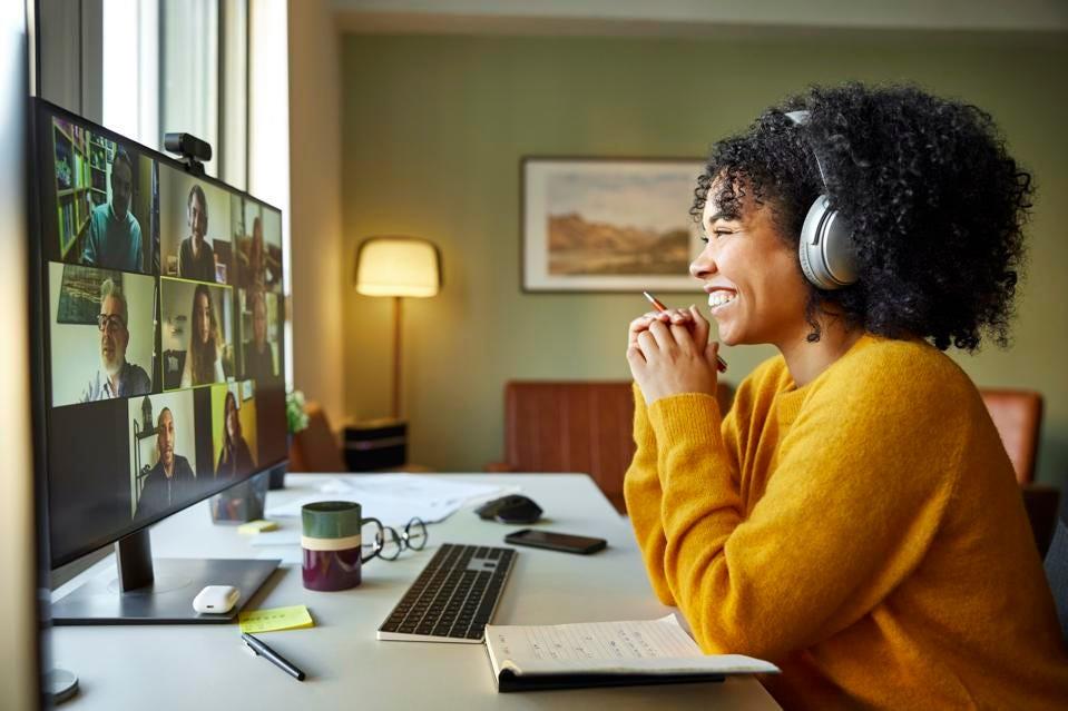 smiling person at a desk