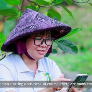 Woman typing on smart phone