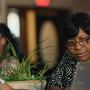 People looking at a laptop