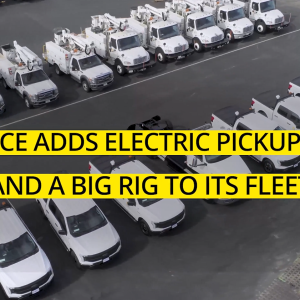 Aerial view of two rows of identical fleet trucks and service vehicles.