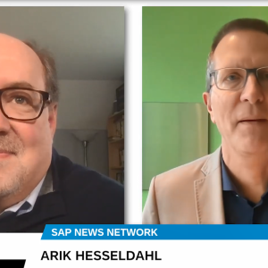 Split screen of two people, Arik Hesseldahl on the right, talking in a virtual meeting.