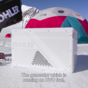 Kohler generator in front of tent and Kohler flag in Antarctica