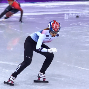 A person in the lead of a speed skating competition