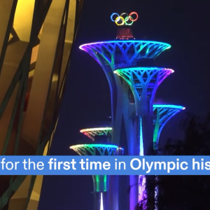 Buildings lit up with olympic rings