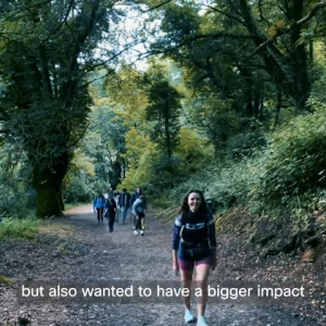 people hiking on a forest trail