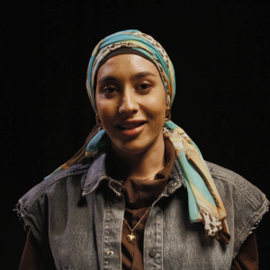 Mariah Idrissi, a black background.