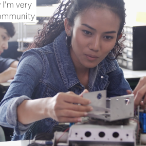 young woman working on building a device