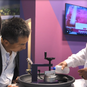 A Chemours employee demonstrating Nafion at a convention.