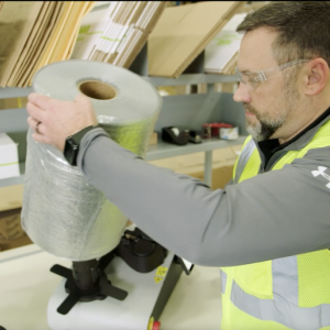 Man with roll of tape. 