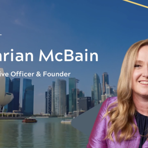 Image of Dr Darian McBain on background of a city landscape 