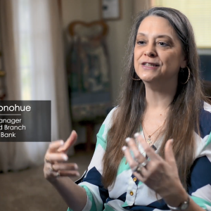 Ginger Donohue being interviewed in a home.