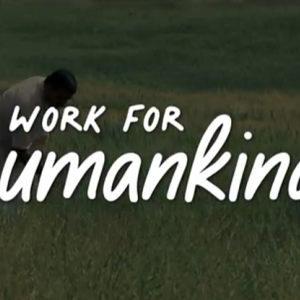 Text "work for human kind" over a person working in a field