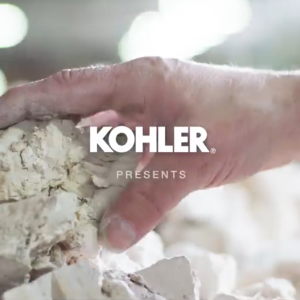 hand grabbing stone