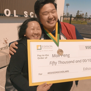 Max Peng with his Mom and a large check.