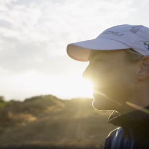 Runner with the sun coming out behind her
