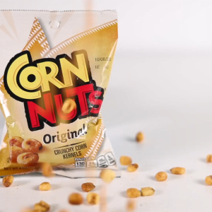Small bag of Corn Nuts and kernels falling down.