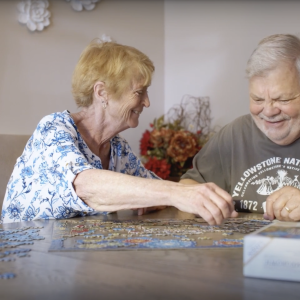 Marion and her husband working on a jigsaw puzzle together