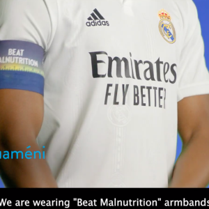 footballer wearing beat malnutrition arm band