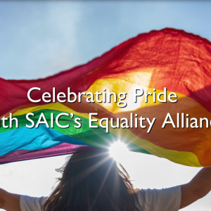 Celebrating Pride with SAIC's Equality Alliance. A person with rainbow flag.