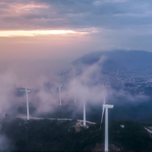 wind turbines in a cloudy sky.
