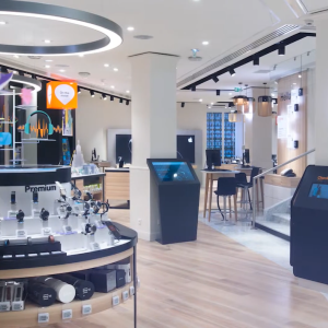 A store with displays of watches and electronics.