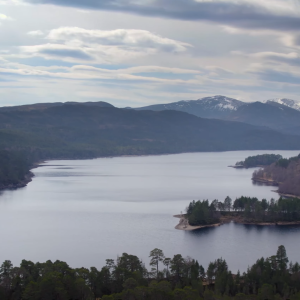 Aerial view of a river through a mountain terrain.