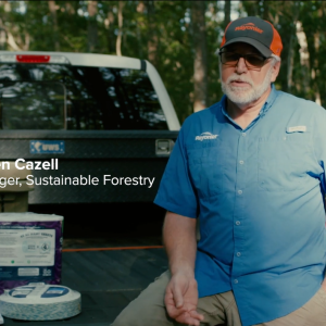 Ben Cazell sitting in the bed of a pick up truck.