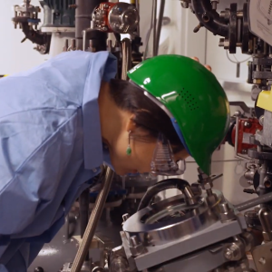 Person wearing a hard hat and safety goggles