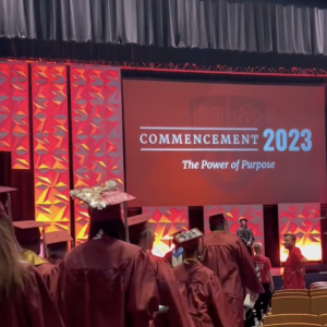 Graduates walking onto a stage