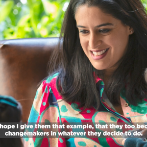 A mother and two small children seated