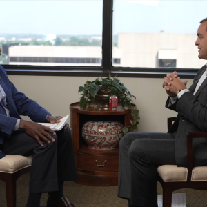 Leroy Abrahams and Mike Suco sat opposite each other