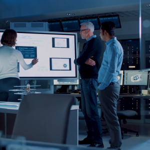 People stood around an interactive board 