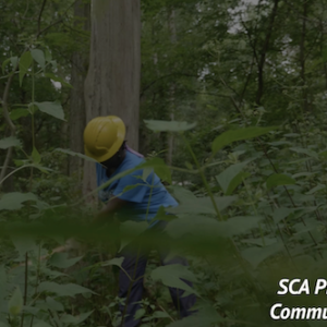 KeyBank SCA Pittsburgh community crew member working in a green space.