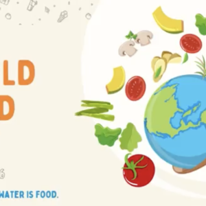 The text "World food day October 12 water is life, water is food" with an illustration of the globe on a wooden spoon, with vegetables 