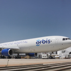 A large plane with Orbis logo on the side.