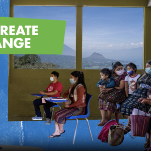 "We create change" people sat on chairs
