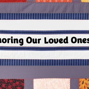 A quilt with "Honoring Our Loved Ones" central.
