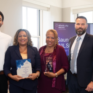 Saundra Wilson and three others posed with awards.