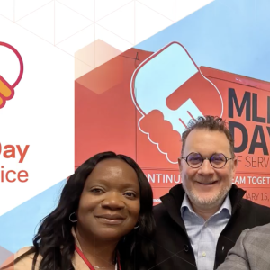 3 people stood together taking a photo