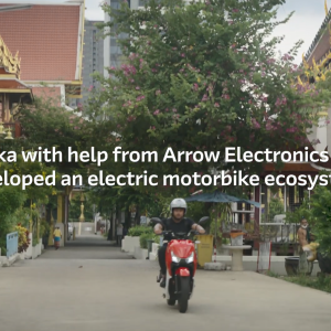 A person riding a motorbike down a street. "Oyika with help from Arrow Electronics has developed and electric motorbike ecosystem."