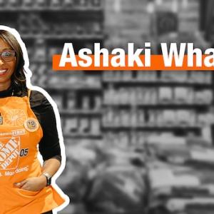 Ashaki Whatley, The Home Depot, shown smiling and wearing an orange apron.
