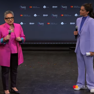 Two people talking on stage 