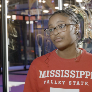 A person wearing a red university sweater 