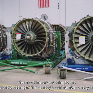 A row of airplane engines on trollies.