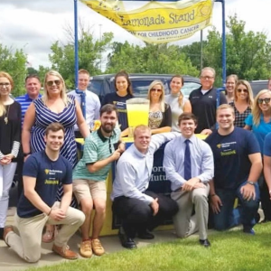 alex's lemonade stand with a group of employees