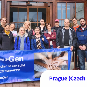A group posed outside a building, holding a banner "Giving at Gen. Together we can build a better tomorrow."