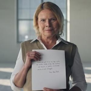 Gay holding her letter.